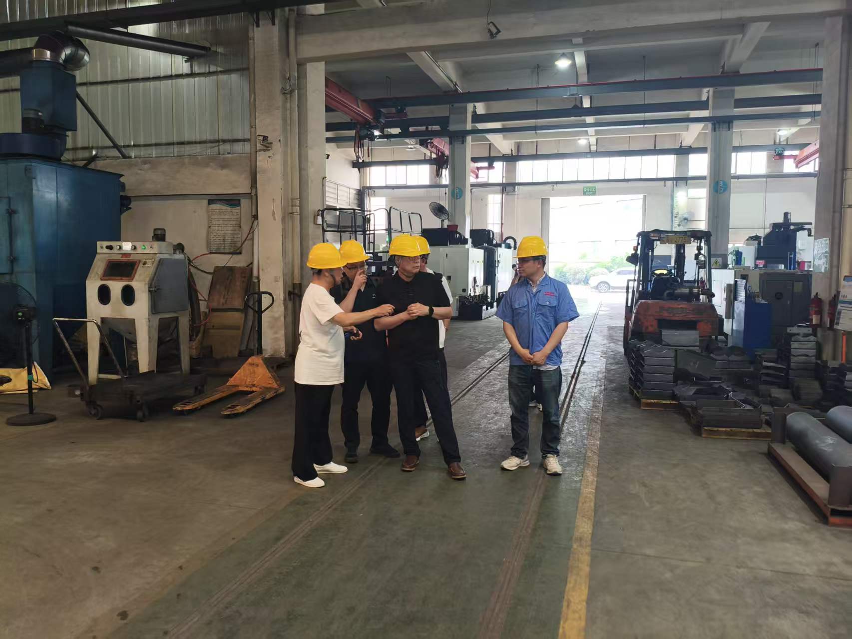 HI AIR representatives observing machining and surface-finishing operations