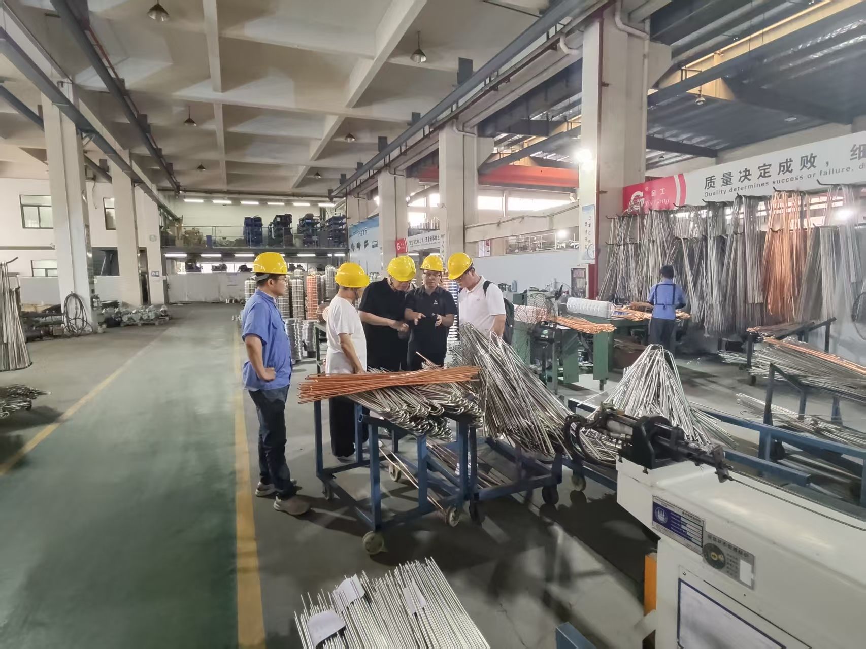 HI AIR delegation touring the U-bend tube processing workshop